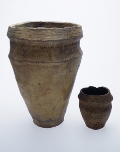 Early Bronze Age crematorium collared urns, larger with finger nail lines to rim, smaller with bird bone impressions, 2,200-700 BC, found London - &copy; Museum of London